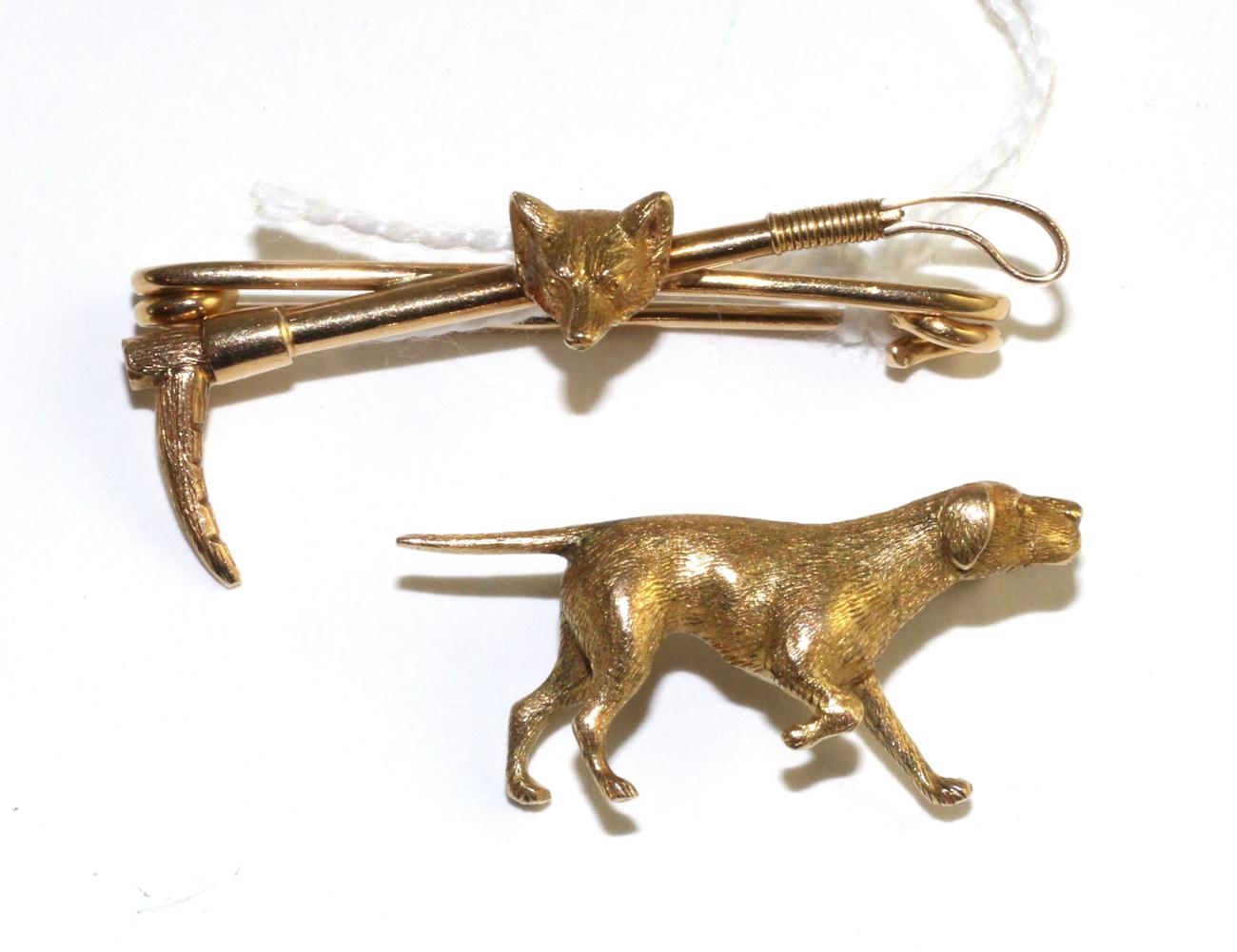 A Pointer dog brooch, realistically modelled in a 'pointing' pose, measures 1.5cm by 3cm and a fox