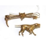 A Pointer dog brooch, realistically modelled in a 'pointing' pose, measures 1.5cm by 3cm and a fox