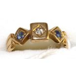 An 18 carat gold diamond and sapphire three stone ring, an old cut diamond in a yellow star