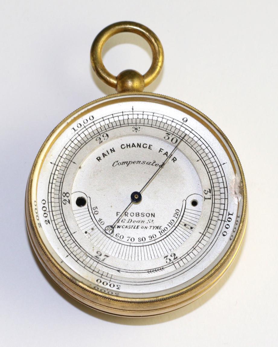 A gilt brass pocket barometer, signed F Robson, Newcastle, circa 1900, 48mm wide, with leather