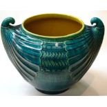 A Linthorpe Pottery Jardiniere, shape No.2285, moulded with repeating designs, turquoise glaze,