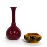 Christopher Dresser for Linthorpe Pottery: A Vase, shape No. 846, maroon glaze, impressed