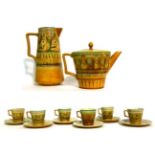 A Set of Six Linthorpe Pottery Tea Cups and Saucers, shape No.1899, decorated with floral sprigs and