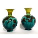 A Matched Pair of Linthorpe Pottery Vases, shape No.1810, decorated with leaves, on a turquoise