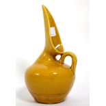 Christopher Dresser for Linthorpe Pottery: A Jug, shape No.346, moulded with repeating designs,