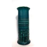 A Linthorpe Pottery Stick Stand, moulded with flower heads and repeating designs in a turquoise