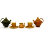 Christopher Dresser for Linthorpe Pottery: A Teapot, shape No.662, mustard glaze, impressed