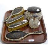 A group of silver and tortoiseshell dressing table items including a scent bottle, London 1919-1924