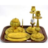 A gilt metal Victorian desk set including a pair of candlesticks, inkwell and a pen stand