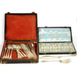 A cased set of Dutch white metal fish knives and forks with servers; together with a cased set of