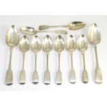 A collection of George III and later silver spoons, comprising eight dessert spoons and two table