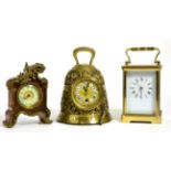 A French brass carriage timepiece signed L'Epee; together with a brass bell shaped timepiece; and