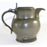 Early 19th century pewter jug with hinged cover