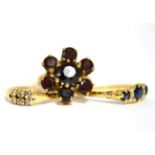 An 18ct gold sapphire and diamond ring, a garnet set flower ring stamped '375' and a diamond set
