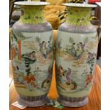 A pair of large Chinese famille rose vases, painted with figures in a pagoda and in a boat