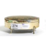 A silver and tortoiseshell mounted oval trinket box, raised on four scroll feet