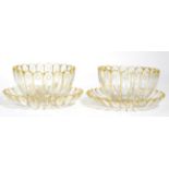 A pair of 19th century cut glass finger bowls/rinsers with stands, each with fluted sides and gilt