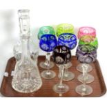 Eight coloured hock glasses, a silver collared glass decanter and a Waterford crystal decanter