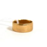 A 9ct gold band ring
