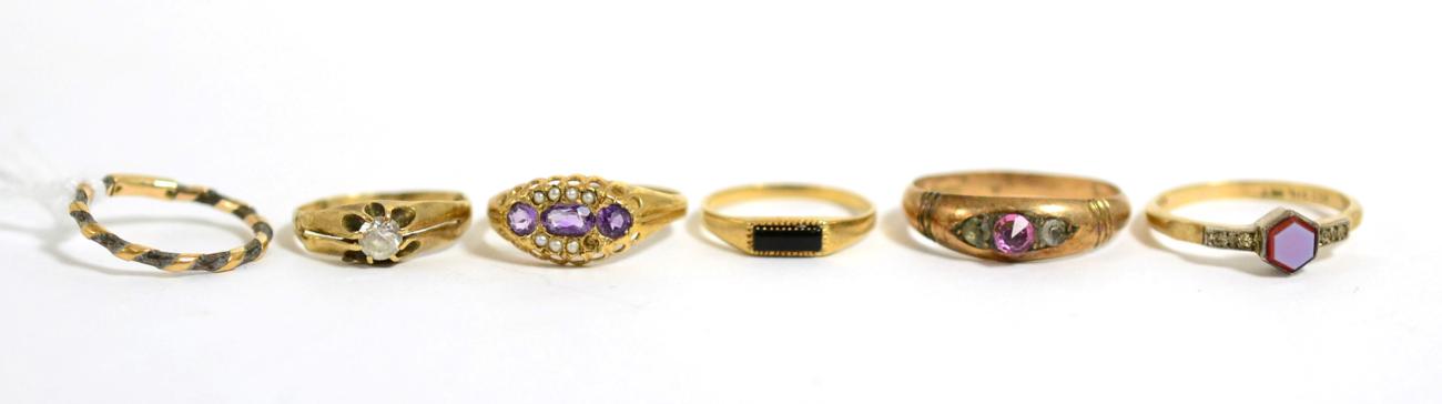 An elephant hair ring, a 9ct gold amethyst and seed pearl ring, a 9ct gold onyx ring, a sardony