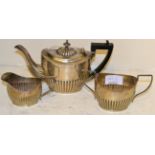 Three piece bachelors silver teaset, part fluted, Birmingham 190213.5ozt