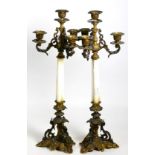 A pair of French gilt metal four light candelabra