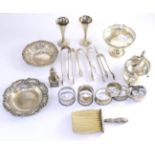 A small group of silver including two dishes, a footed bowl, a sauce boat, a pair of bud vases,