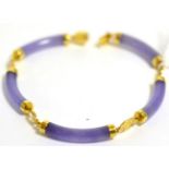 A 14ct gold and Chinese jade bracelet 10.2g