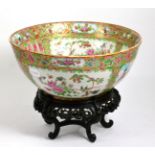 A Chinese export Canton porcelain bowl, on carved wood stand