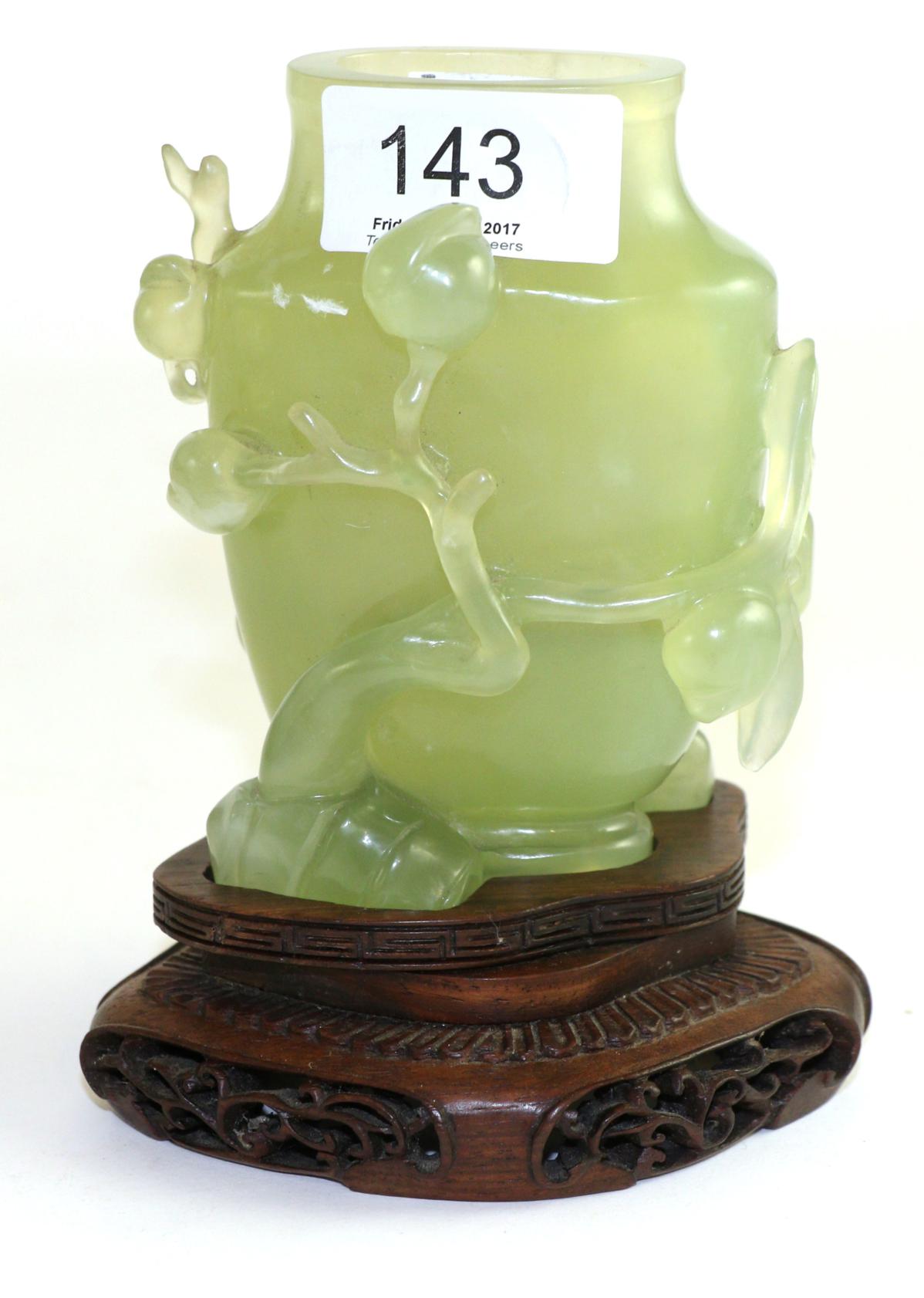 A Chinese jade carving on stand