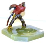 A cold painted and onyx parrot ashtray