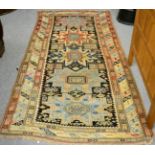 A 19th century Lesghi rug, South Caucasus, the charcoal field with five stars enclosed by ivory