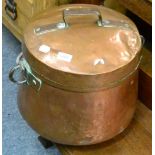 A large 19th century copper lidded pot with swing handle