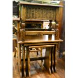 A reproduction nest of tables and a reproduction oak sewing box/stool (2)