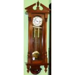 A reproduction Vienna type striking wall clock, twin weight driven movement