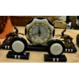 An Art Deco style onyx and gilt metal clock garniture (3)