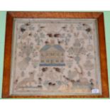 A burr walnut framed sampler titled 'Anno 1782', worked in pale blue and cream cross stitch, with