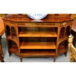 An Edwardian string inlaid side cabinet with open shelves on tapering square supports