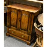 A Titchmarsh & Goodwin oak cabinet, model RL776/NC, two fielded cupboard doors with H brass