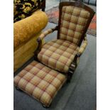 A Victorian mahogany framed button backarm chair and stool in matching chequered fabric