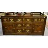 A Jacobean style oak sideboard