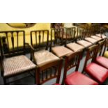 A set of eight (6+2) rail back dining chairs with drop in seats