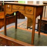 An 18th century oak lowboy, three drawers, with square chamfered legs