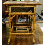 A Victorian bamboo and lacquer sewing table in the Aesthetic taste, with green silk lined interior