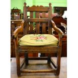 Two oak armchairs with lattice backs