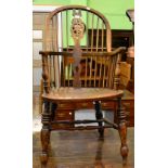 A Windsor armchair on turned supports