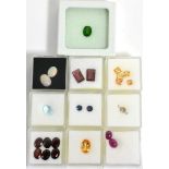 A Quantity of Loose Gemstones, including three round brilliant cut diamonds, two cabochon rubies,