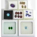 A Quantity of Loose Gemstones, including, a cabachon amethyst, an opal, an aquamarine, two chrome