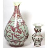 A large Chinese underglaze red porcelain pear shaped vase and an underglaze red baluster vase