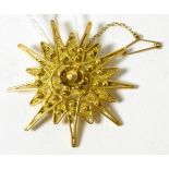 An 18ct gold filigree star brooch 15.01g gross